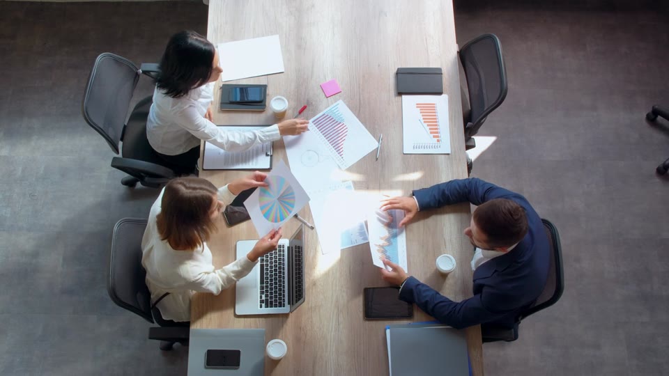 Colleagues collaborating around a meeting table